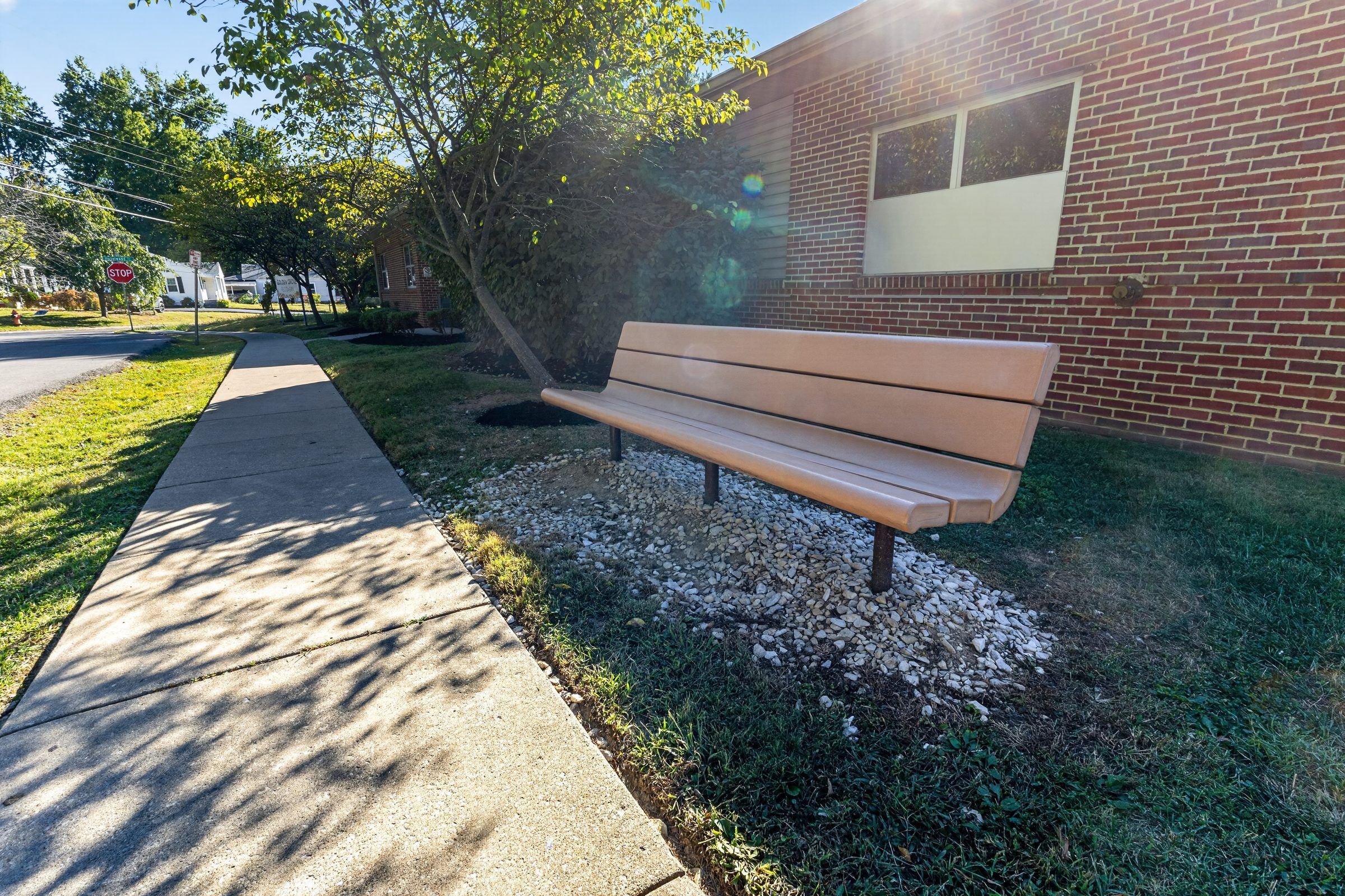 A bench beside the walkway outside Golden Grove Recovery in Louisville